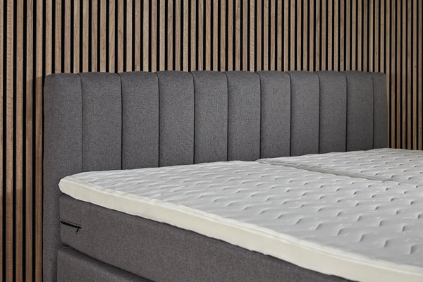 Antraciet Boxspring Comfort bed with built-in storage from Bedden.nl, featuring a sleek design and plush upholstery.
