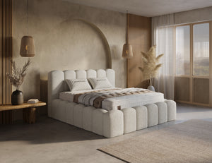 Beige boxspring bed with built-in storage drawers from Bedden.nl, featuring a sleek design and included mattress.