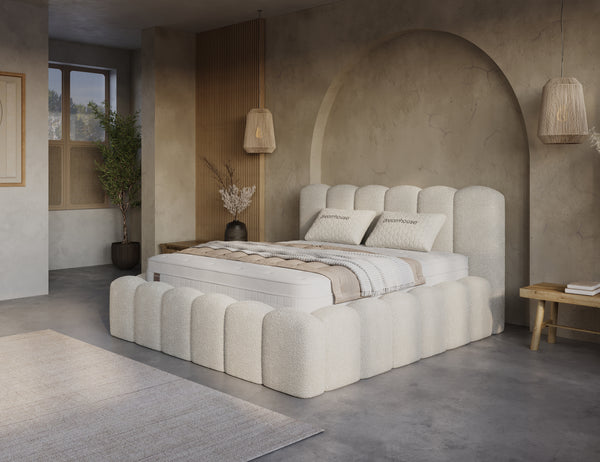 Beige boxspring bed with built-in storage and mattress from Bedden.nl, featuring a sleek design and easy assembly.